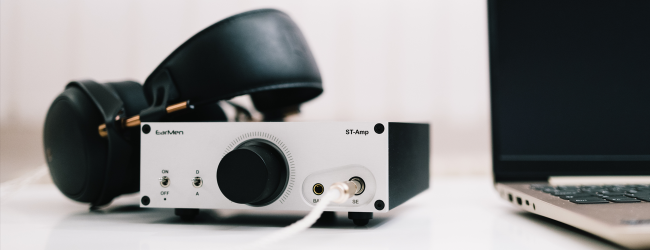 EarMen's ST-Amp headphone amp pictured with Meze LIRIC