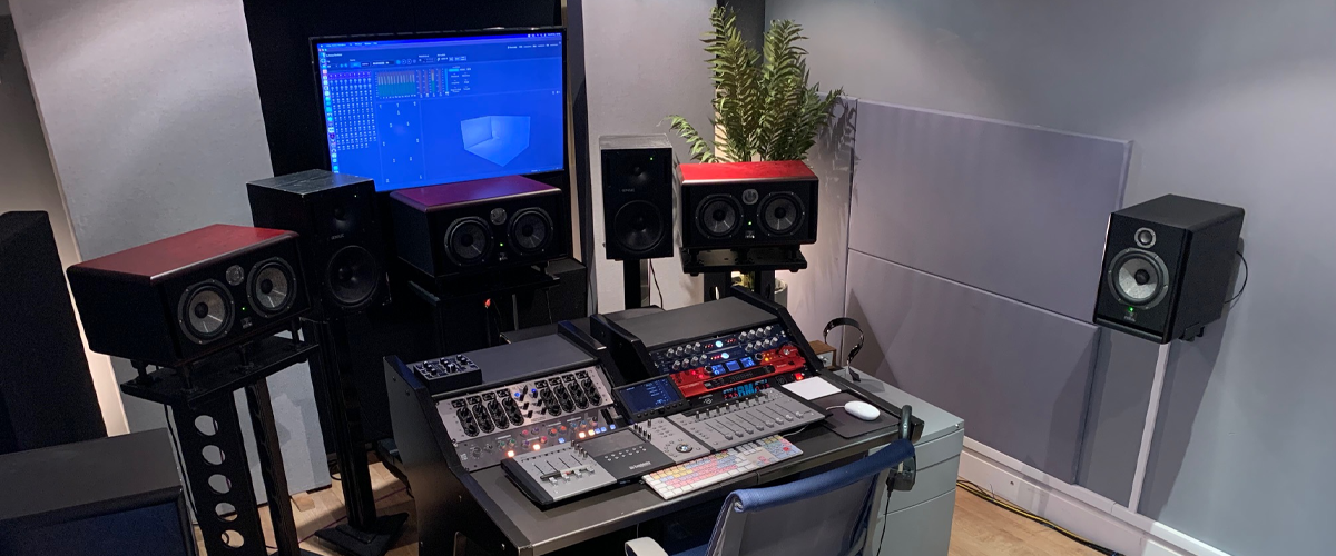 Starboard Music Group's main mixing console featuring Focal studio monitor Atmos configuration